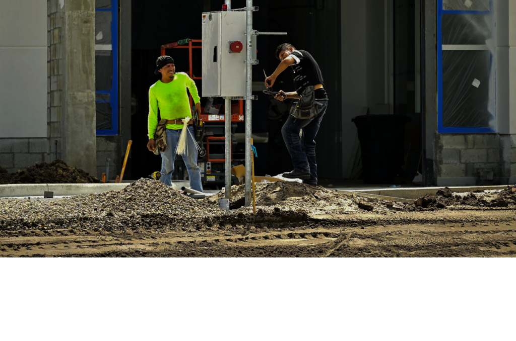 Electrician working on commercial lighting installation
